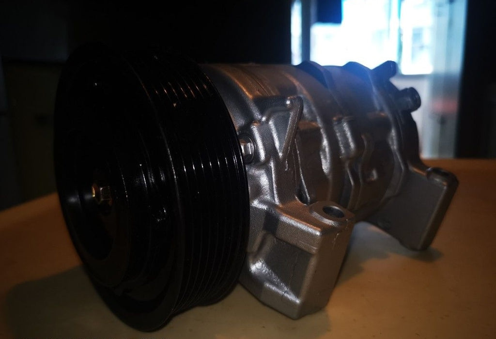 Automotive air conditioning compressor with pulley and mounting brackets