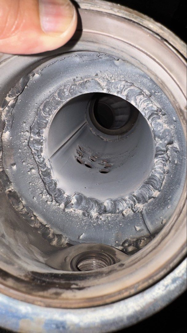 Close-up of BMW F30 N20 downpipe catalytic-converter opening