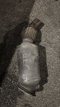 Rear view of BMW F30 N20 downpipe and catalytic-converter assembly