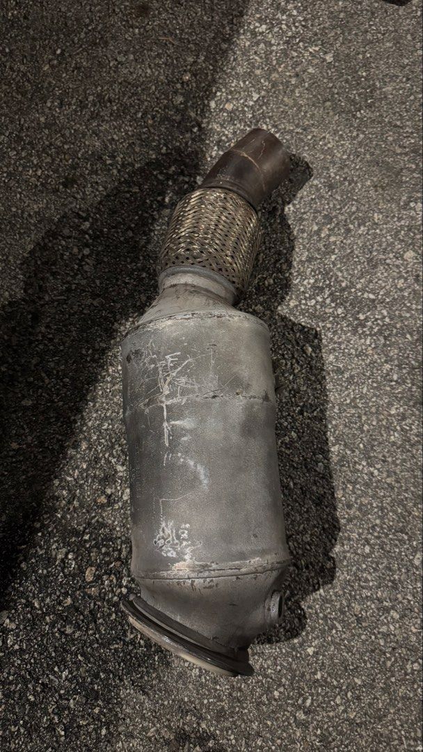 Rear view of BMW F30 N20 downpipe and catalytic-converter assembly