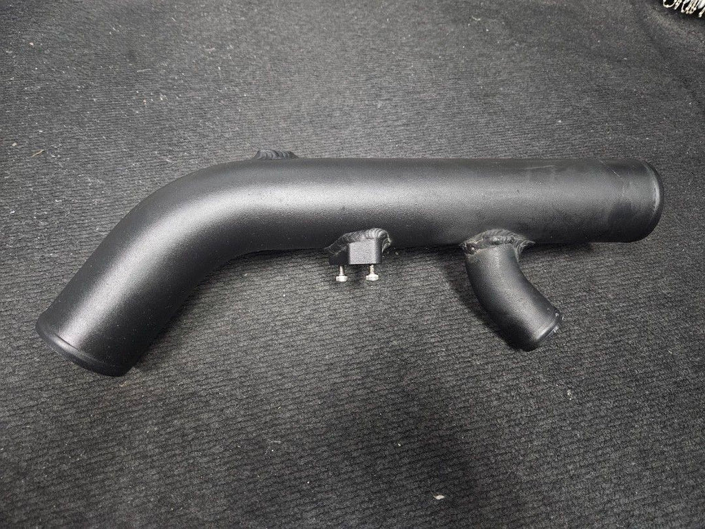 Reverse view of black charge pipe with mounting points