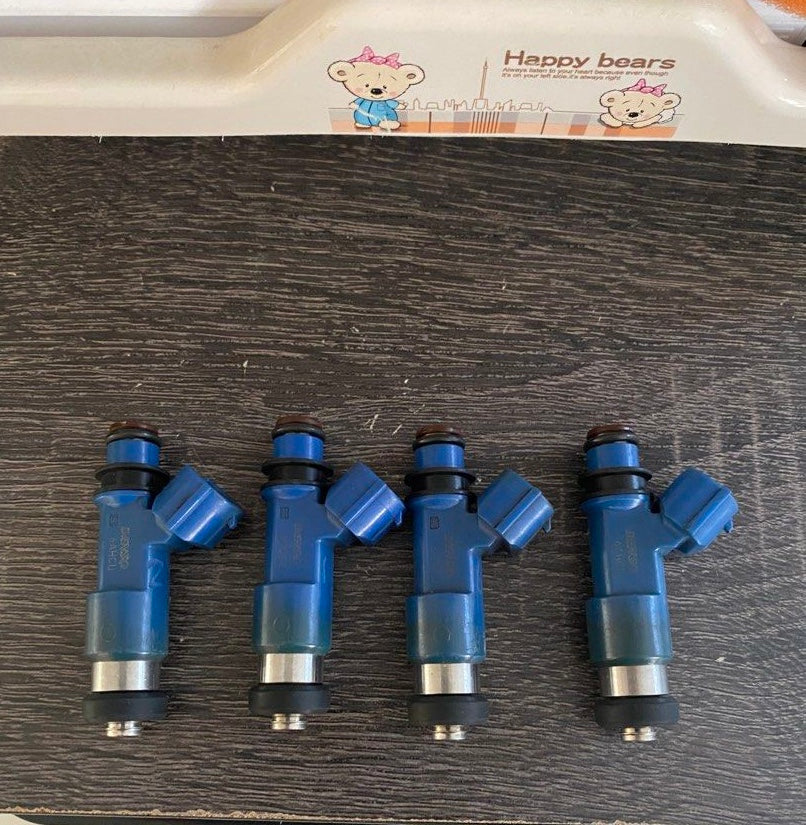 DeatschWerks 850cc Subaru fuel injector with blue body and electrical connector