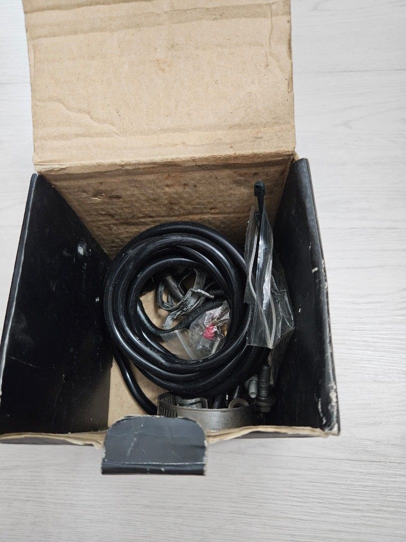 Forge blow-off valve kit with hose and hardware in box