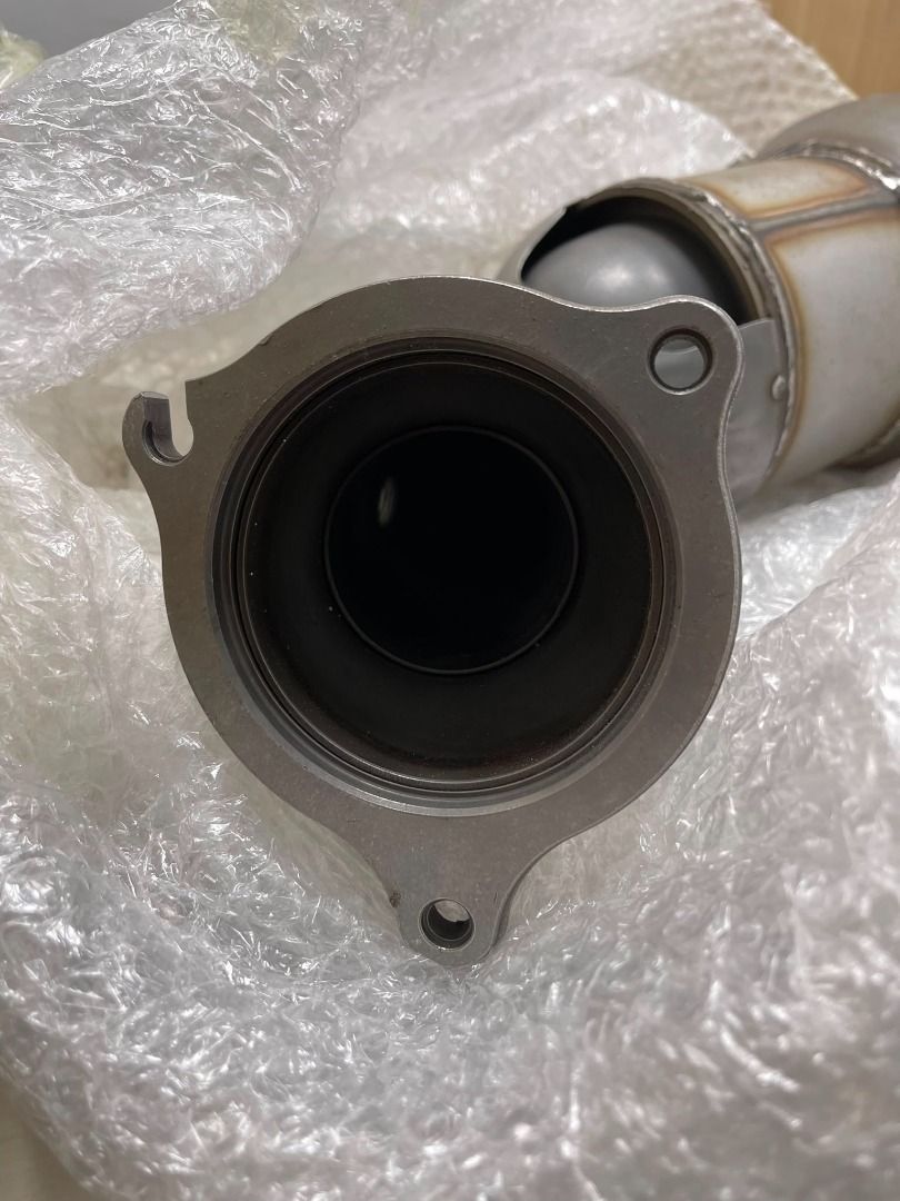 Jaguar XE petrol catalytic downpipe inlet flange close-up