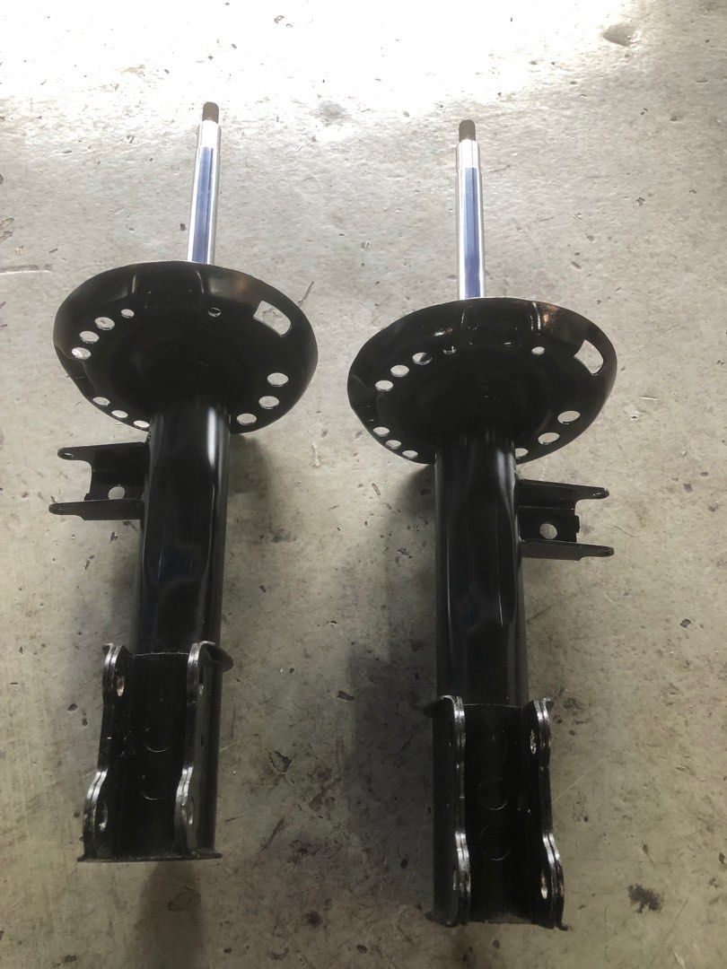 Two Mercedes-Benz GLA W156 front struts viewed from front