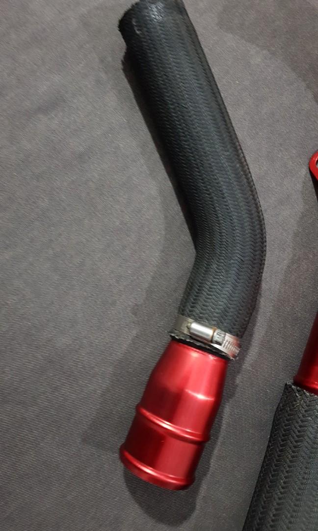 Mitsubishi Evo X red upper intercooler pipe mounting and hose detail