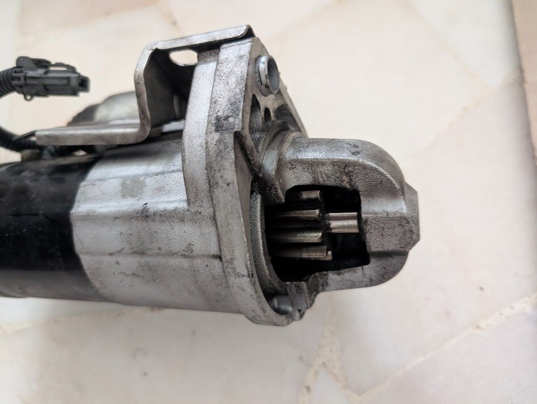 Nissan GT-R R35 starter motor with mounting flange and connector