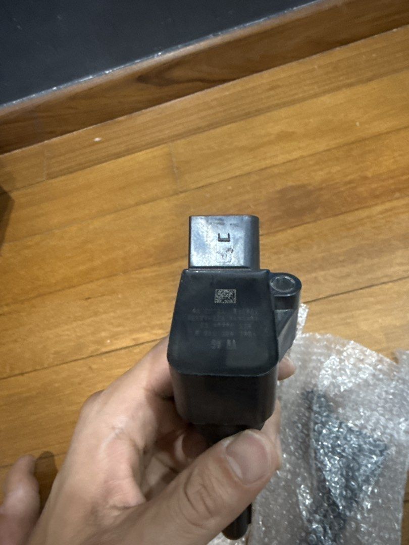 VW Audi ignition coil showing electrical connector and coil housing