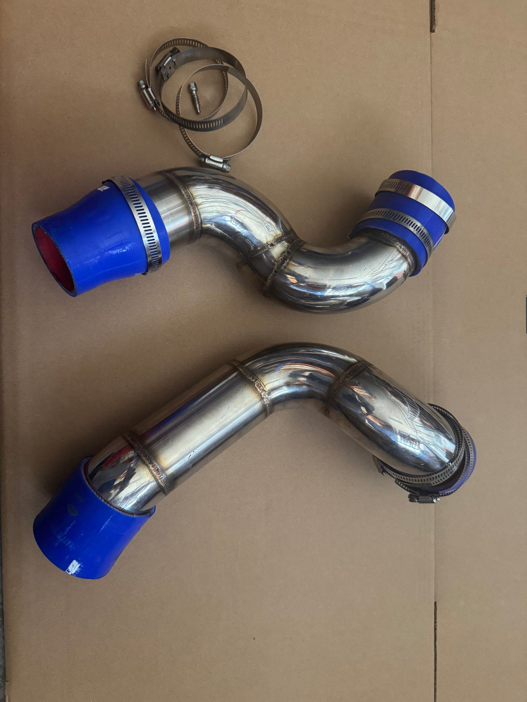 Two W204 C180 intercooler charge pipe sections with blue couplers